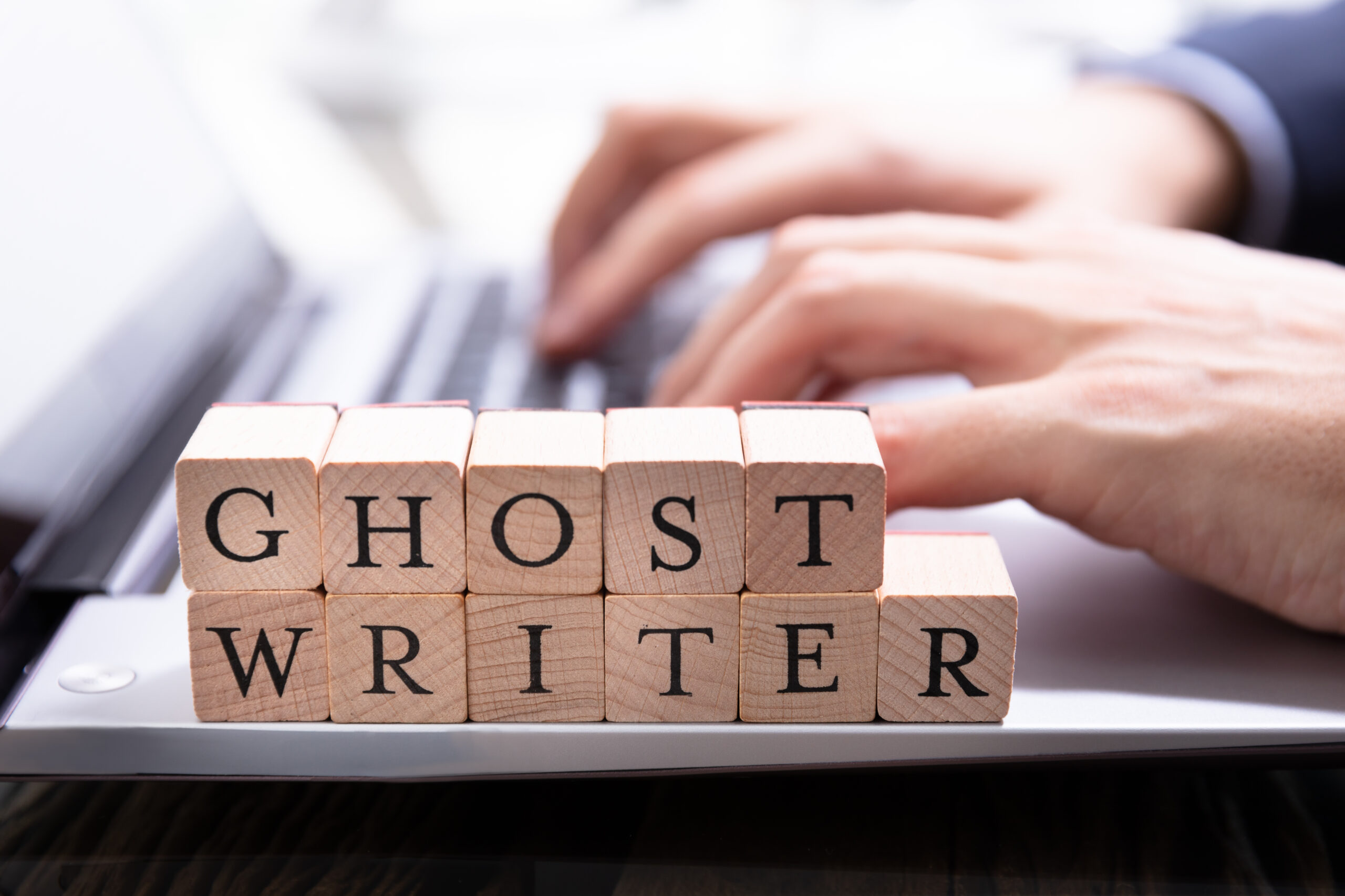 Ghostwriter Wooden Block On Computer Keyboard